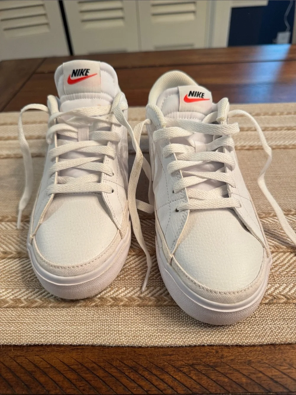 Nike White Low-Top Sneakers with Red Tongue Logo